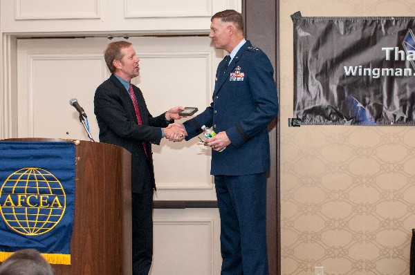 Scott Hardiman, chapter president, presents a memento of appreciation to Lt. Gen. Andrew E. Busch, USAF, vice commander, Air Force Materiel Command, for his address to the chapter’s November guest series luncheon.